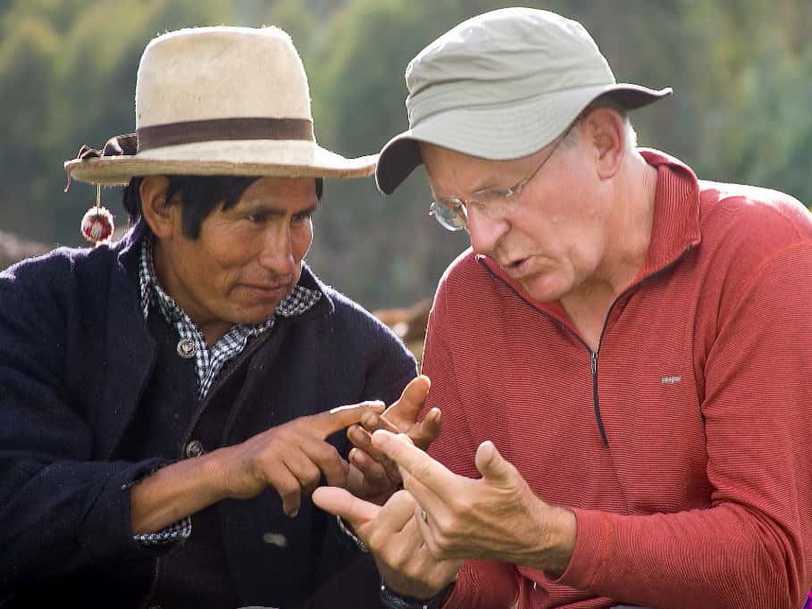 Two men exchanging language in Vicos, Peru - RESPONSible Travel Peru