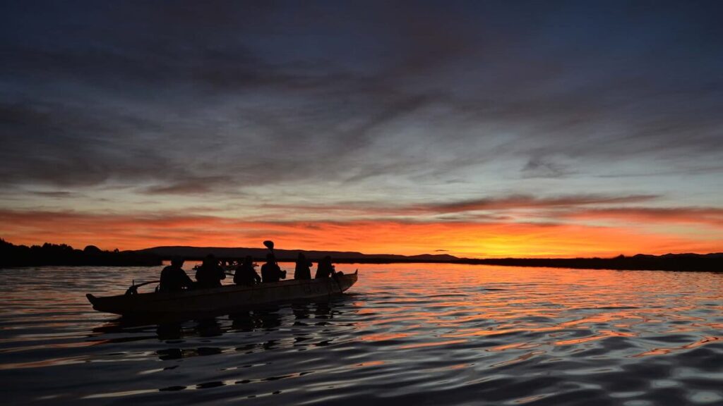 Row on Lake Titicaca in a Polynesian Canoe by sunset - RESPONSible Travel Peru