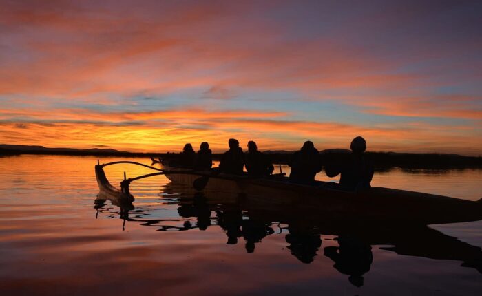Row on Lake Titicaca in a Polynesian Canoe by sunset - RESPONSible Travel Peru
