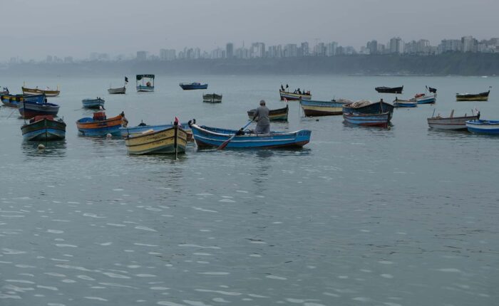 Fishing boats anchored at Chorrillos bay | Responsible Travel Peru