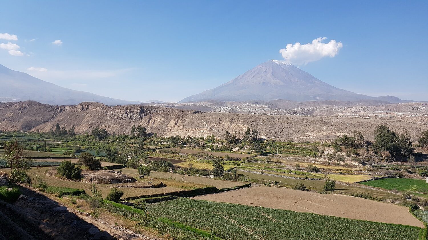 The campiña of Arequipa, the rural area around the city, with volcanoes on the background - RESPONSible Travel Peru