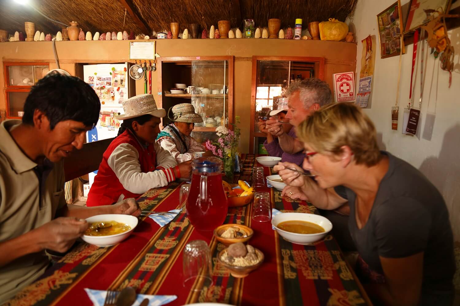 11Travelers enjoying a typical meal in Coporaque, Colca Canyon. Community-based tourism in Peru with RESPONSible Travel Peru.