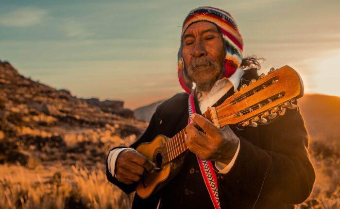 Local man from Jayujayani playing the charango - RESPONSible Travel Peru