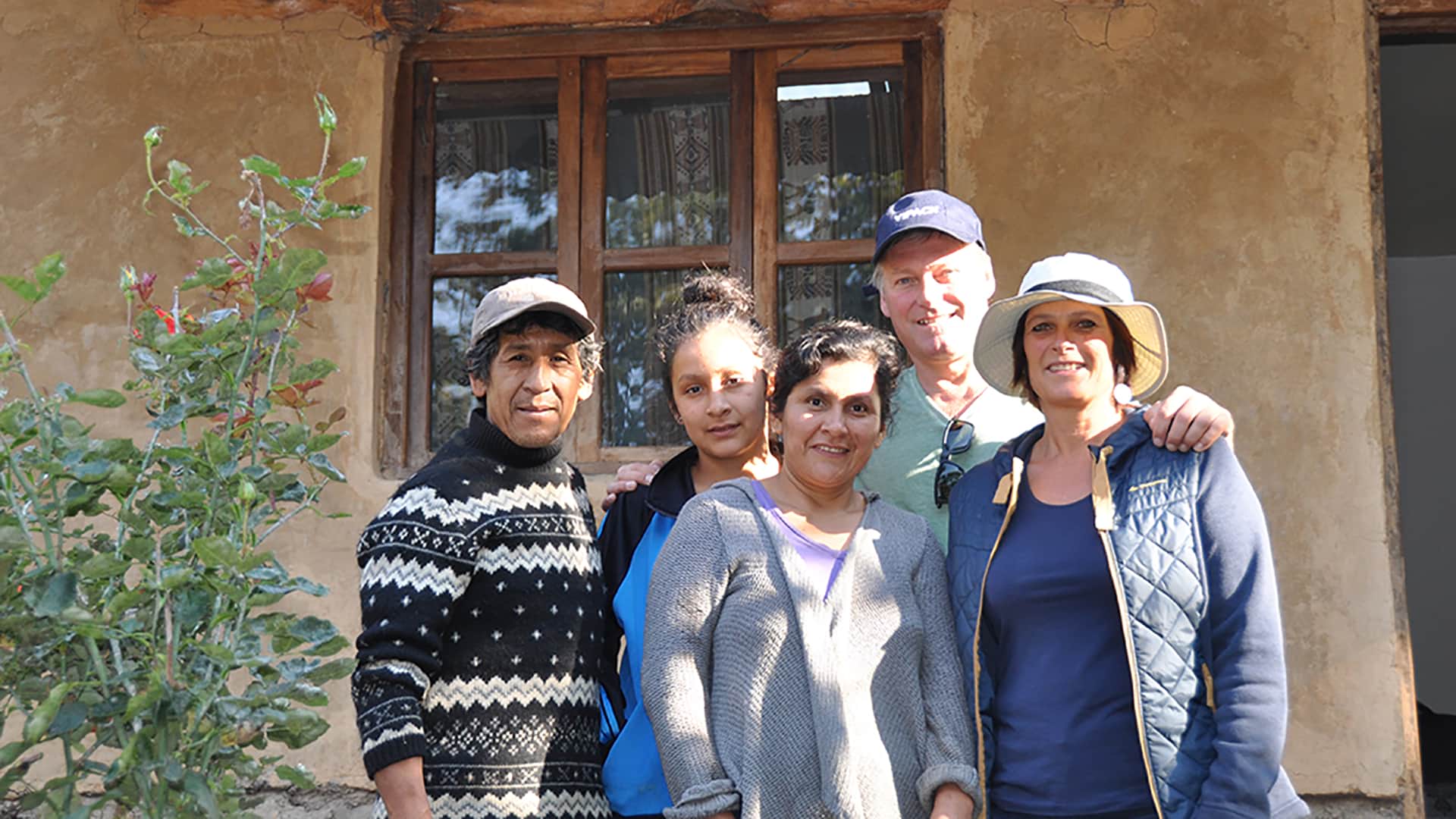 Coffee farmer family welcoming visitors in their home along the Coffee Route to Machu Picchu - RESPONSible Travel Peru