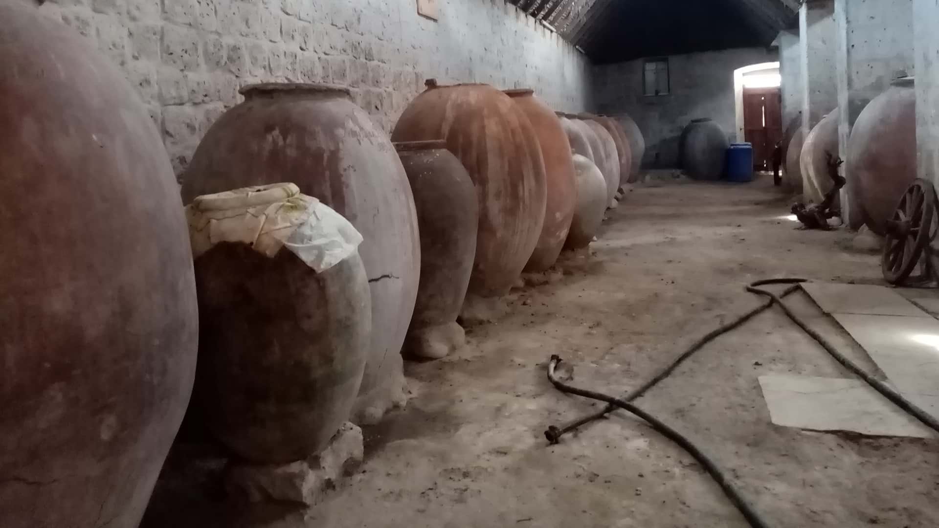 11Large clay jars on a dirt floor storage facility seen during a tour with Responsible Travel Peru from Arequipa