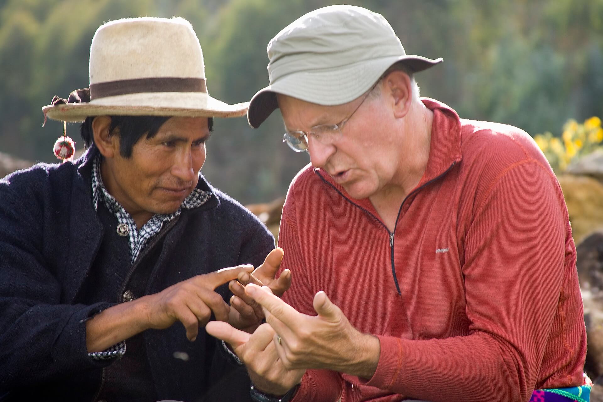 11Two men practicing counting in their languages, Quechua and English, in Vicos Peru. Community-Based Tourism in Peru with RESPONSible Travel Peru