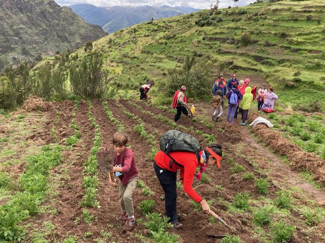 11A group of travelers working the land in the community of Huaman | Responsible Tra