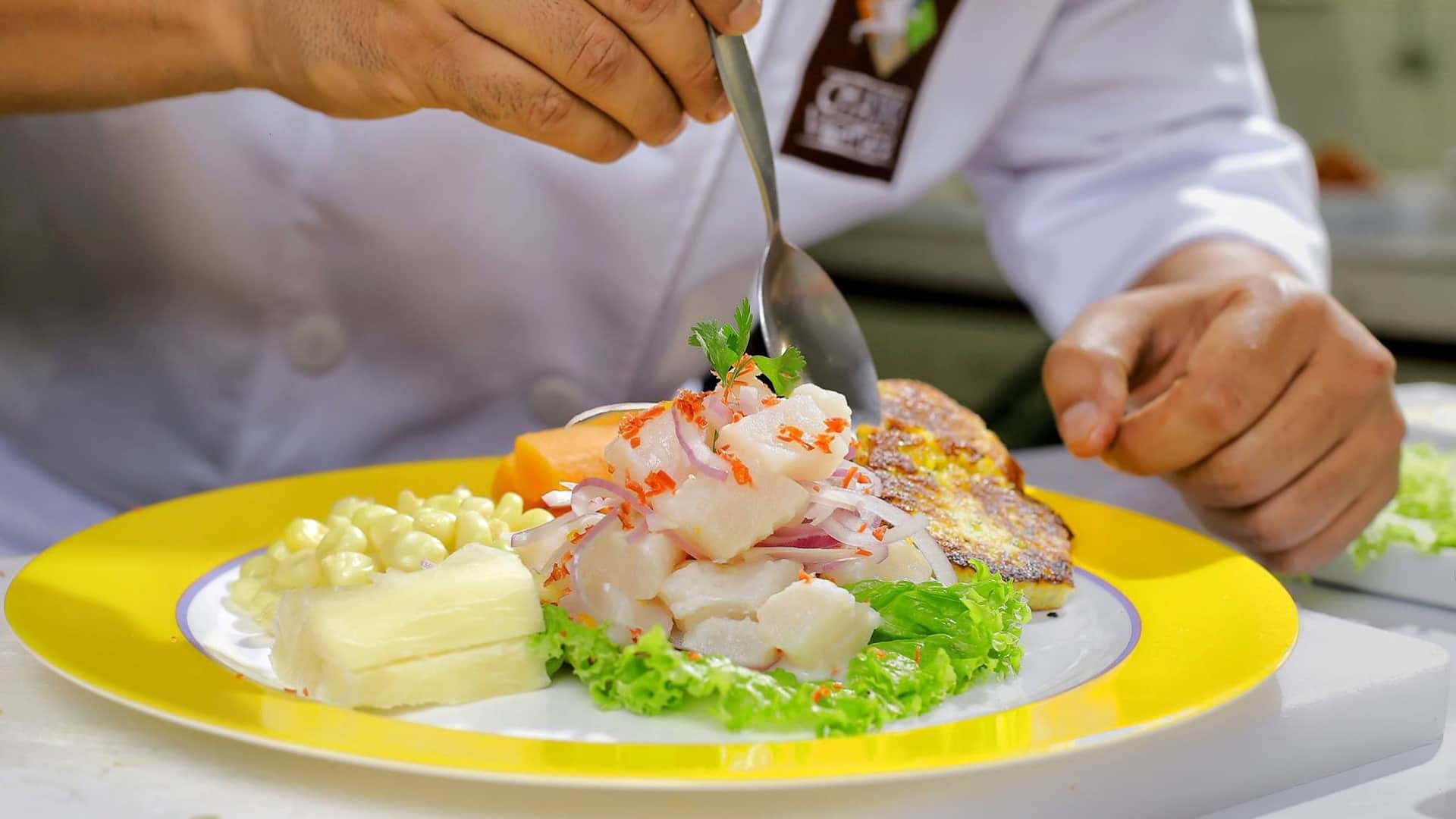 11Close up of a chef serving ceviche on a dish | Responsible Travel Peru