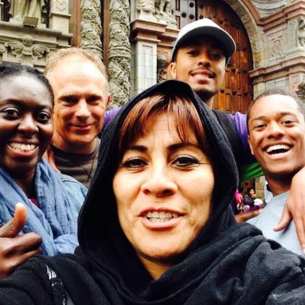 Rosario our guide in a hoodie loves taking selfies with the travelers | Responsible Travel Peru