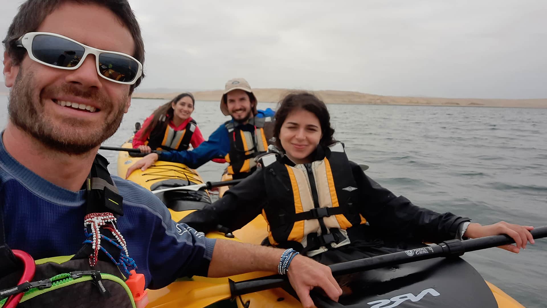 11Selfie in kayak - Eduardo our guide and three happy passengers posing for the pic over the waters of Paracas | Responsible Travel Peru