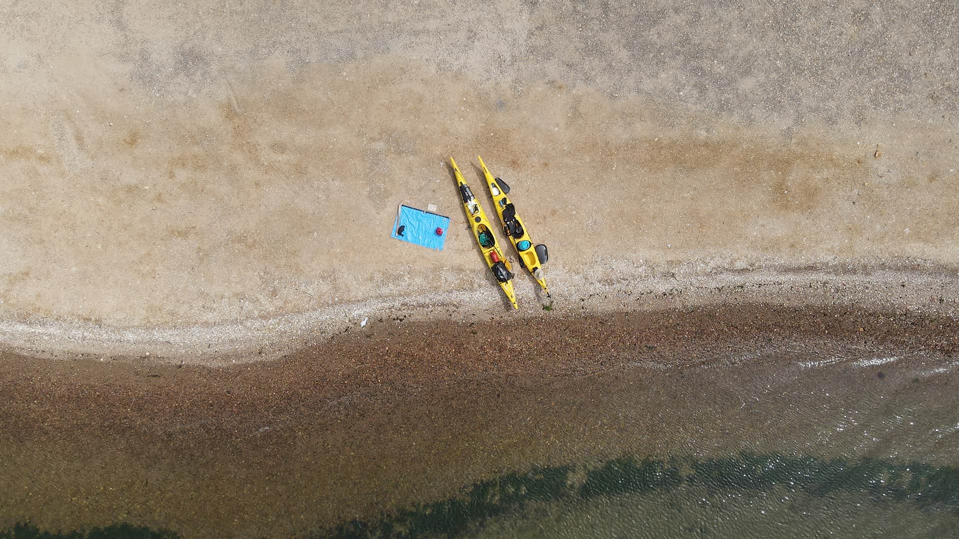 11two kayaks and equipment stationed on beach in Paracas
