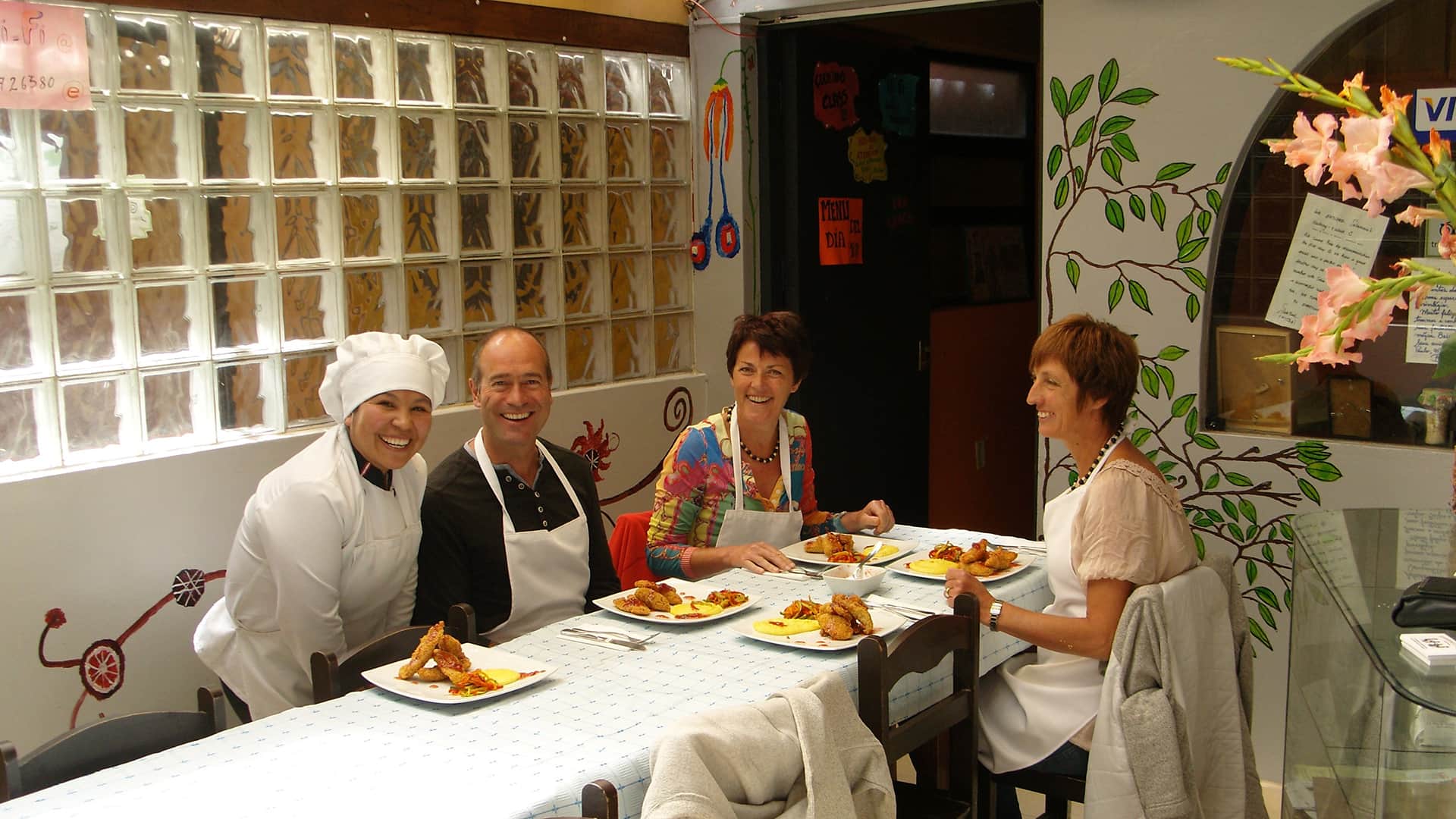 11Lunch ready and served at the table while Selia is posing with three passengers who took her cooking class | Responsible Travel Peru