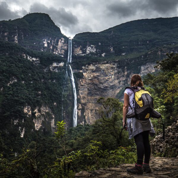 Girl looking at Gocta waterfall from afar