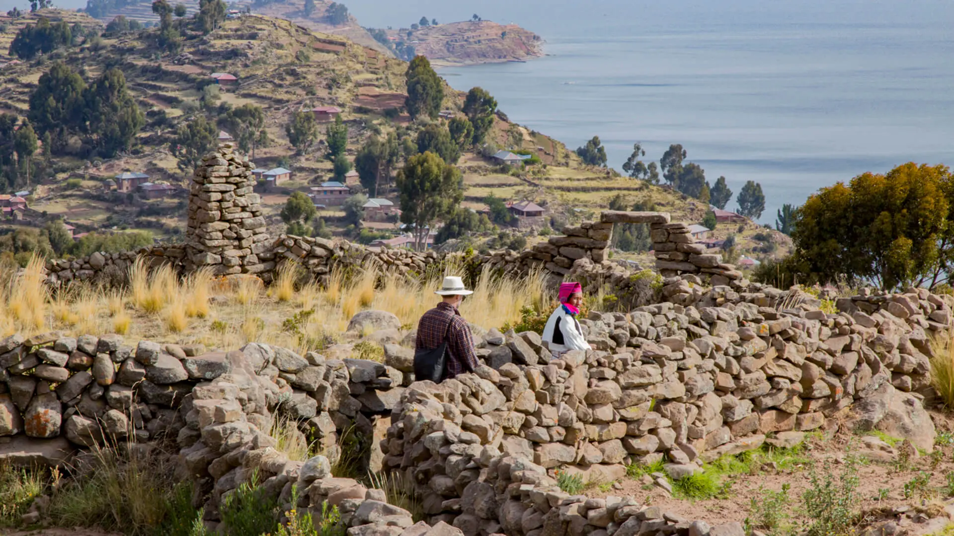 Taquile island's lanscape of rockwalled paths, cropfields and the lake Titicaca | RESPONSible Travel Peru
