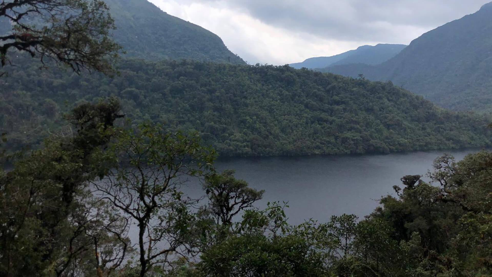 The Condor Lagoon close to Leymebamba lying peaceful between the mountains. ©️ Shawn Wroughton