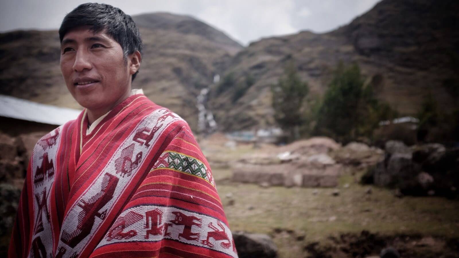 Octavio is one of our top guides. He was born in the small mountain community of Suttoc Pacchac, next to Huacahuasi where he is depicted here, wearing a traditional poncho made by his family. | RESPONSible Travel Peru